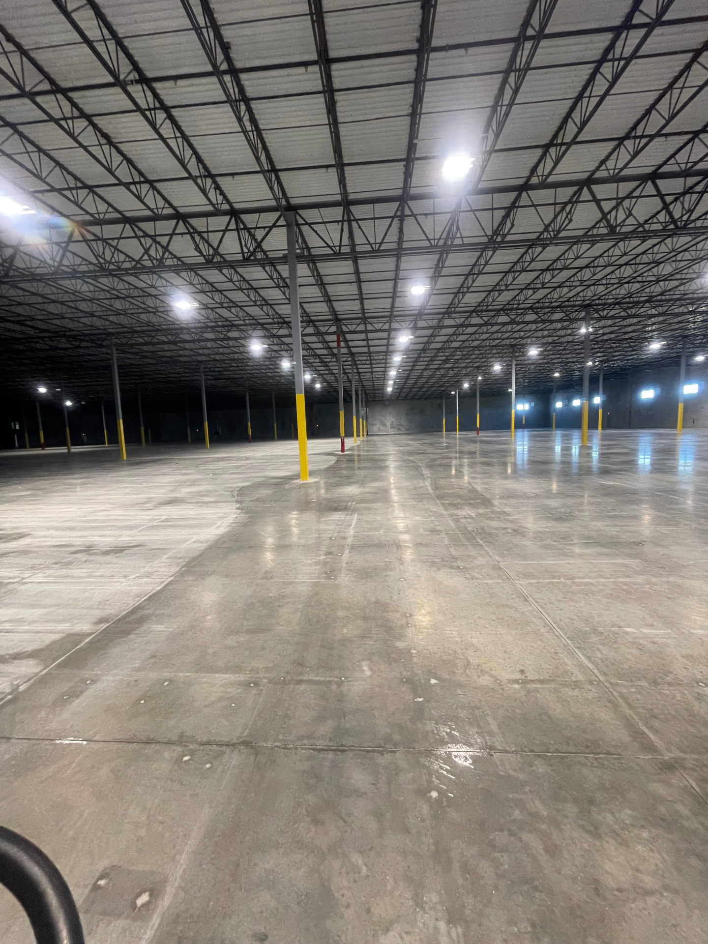 Finished concrete floor across a large industrial warehouse in Seguin, Texas
